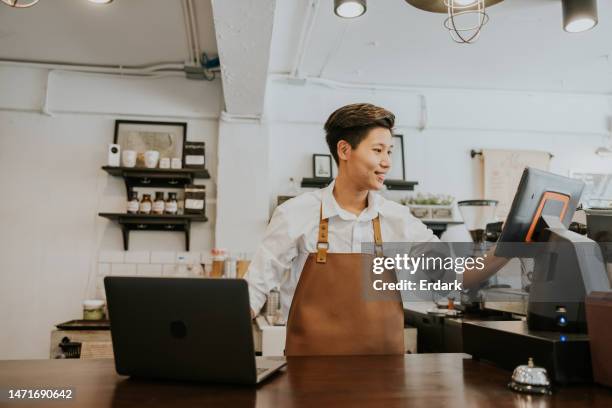 busy day of owner coffee shop, checking stock and ordering from online store. - caixa registadora imagens e fotografias de stock