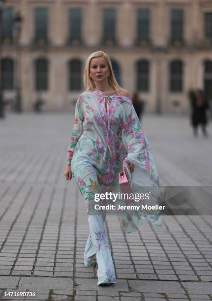 Palina Kozyrava seen wearing Natkina diamond flower earrings and diamond rings, Leonard light blue with pink flower print pattern asymmetrical...