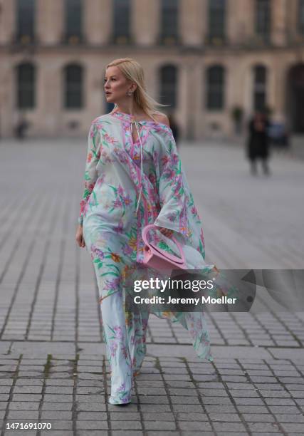 Palina Kozyrava seen wearing Natkina diamond flower earrings and diamond rings, Leonard light blue with pink flower print pattern asymmetrical...