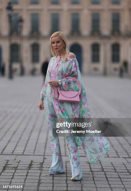 Palina Kozyrava seen wearing Natkina diamond flower earrings and diamond rings, Leonard light blue with pink flower print pattern asymmetrical...