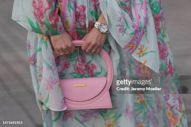 Palina Kozyrava seen wearing Natkina diamond rings, Leonard light blue with pink flower print pattern asymmetrical blouse, matching Leonard light...