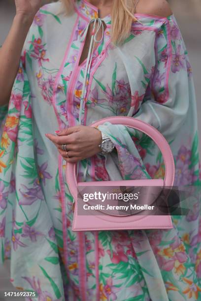 Palina Kozyrava seen wearing Natkina diamond rings, Leonard light blue with pink flower print pattern asymmetrical blouse, matching Leonard light...