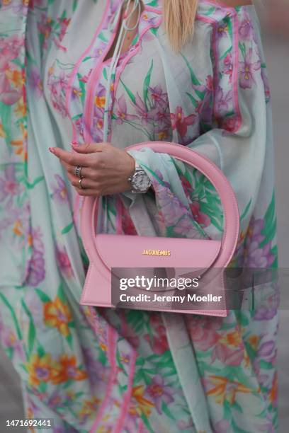 Palina Kozyrava seen wearing Natkina diamond rings, Leonard light blue with pink flower print pattern asymmetrical blouse, matching Leonard light...