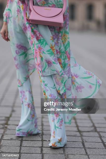 Palina Kozyrava seen wearing Leonard light blue with pink flower print pattern asymmetrical blouse, matching Leonard light blue with pink flower...
