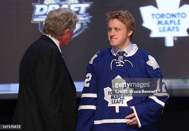 Morgan Rielly, fifth overall pick by the Toronto Maple Leafs, looks on during Round One of the 2012 NHL Entry Draft at Consol Energy Center on June...