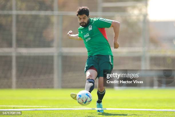 Nestor Araujo of Mexico passes the ball during a training session of Mexico's National Football team at Centro de Alto Rendimiento on March 06, 2023...