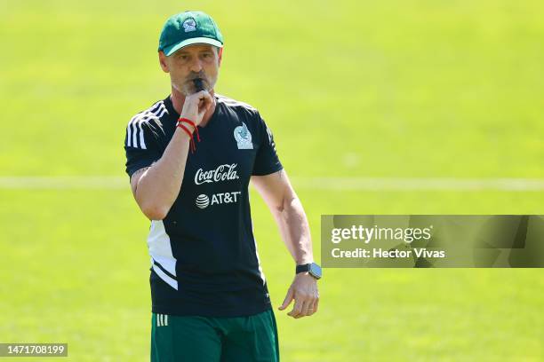 Head coach Diego Cocca blows a whistle during a training session of Mexico's National Football team at Centro de Alto Rendimiento on March 06, 2023...