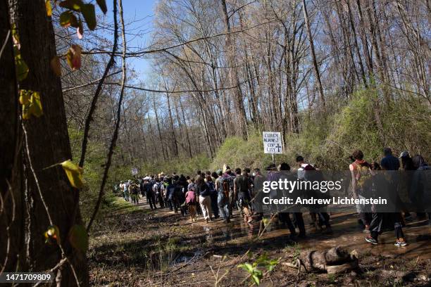 Environmental activists hold a rally and a march through the Atlanta Forest, a preserved forest Atlanta that is scheduled to be developed as a police...