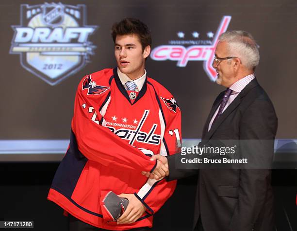 Thomas Wilson, 16th overall pick by the Washington Capitals, shakes hands on stage during Round One of the 2012 NHL Entry Draft at Consol Energy...
