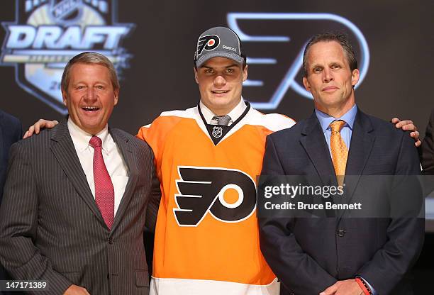 Scott Laughton , 20th pick overall by the Philadelphia Flyers, poses with Flyers representatives during Round One of the 2012 NHL Entry Draft at...