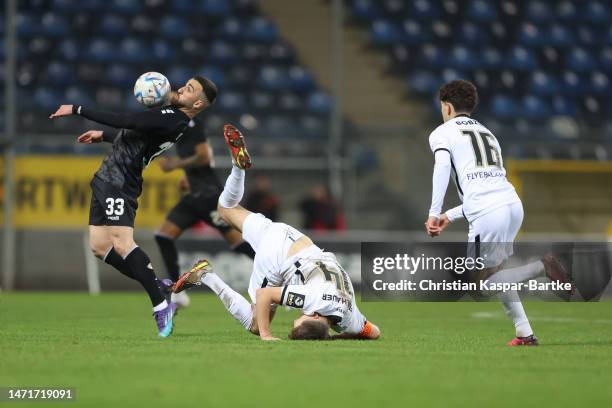 Berkan Taz of SV Waldhof Mannheim challenges Robin Fellhauer of SV 07 Elversberg during the 3. Liga match between SV Waldhof Mannheim and SV 07...