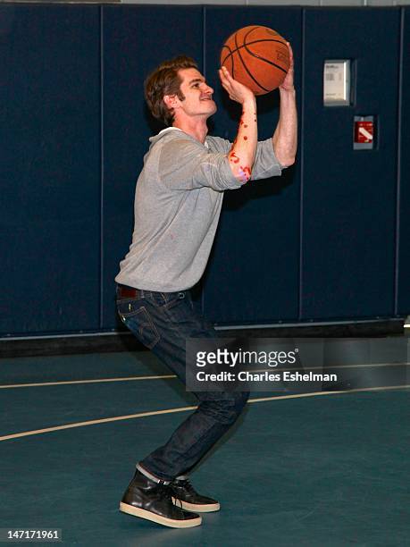 Actor Andrew Garfield attends the "Be Amazing" Stand Up Volunteer Initiative at Madison Boys And Girls Club on June 26, 2012 in the Brooklyn borough...