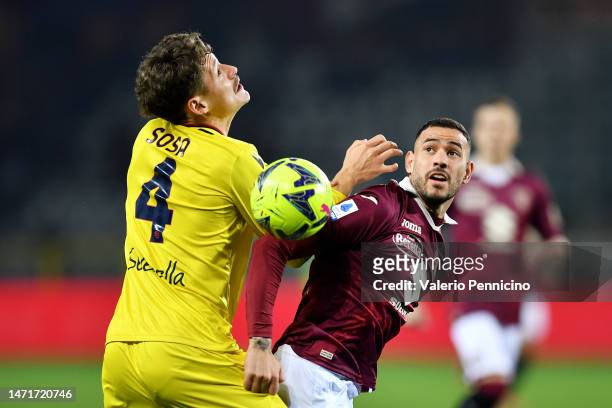 Antonio Sanabria of Torino FC battles for possession with Joaquin Sosa of Bologna FC during the Serie A match between Torino FC and Bologna FC at...