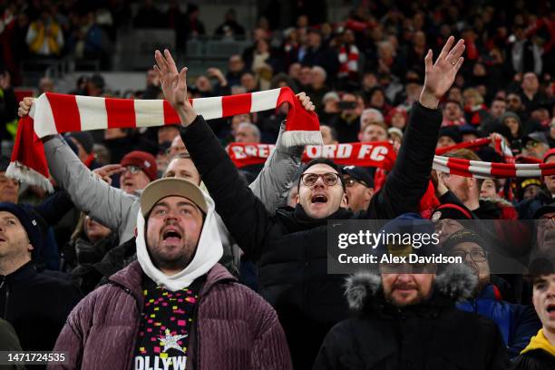 Fans of Brentford show their support prior to the Premier League match between Brentford FC and Fulham FC at Gtech Community Stadium on March 06,...