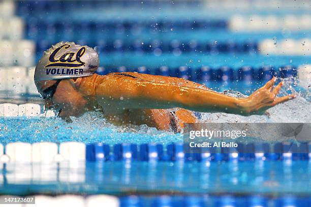 Dana Vollmer competes in the championship final heat of the Women's 100 m Butterfly during Day Two of the 2012 U.S. Olympic Swimming Team Trials at...