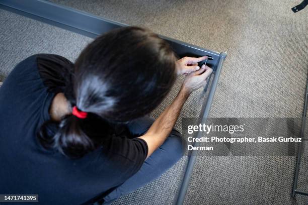 man assembling bed base at home - dismantling stock pictures, royalty-free photos & images