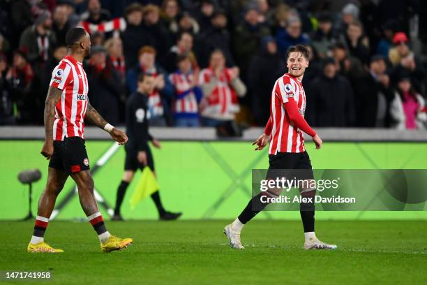 Mathias Jensen of Brentford celebrates after scoring the team's third goal with Ivan Toney during the Premier League match between Brentford FC and...