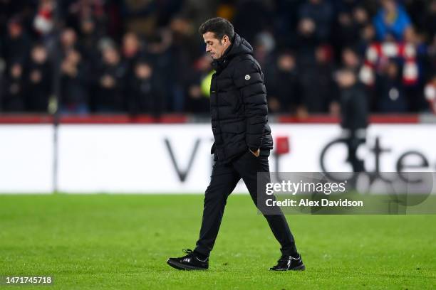 Marco Silva, Manager of Fulham, looks dejected as they leave the pitch after their side's defeat in the Premier League match between Brentford FC and...