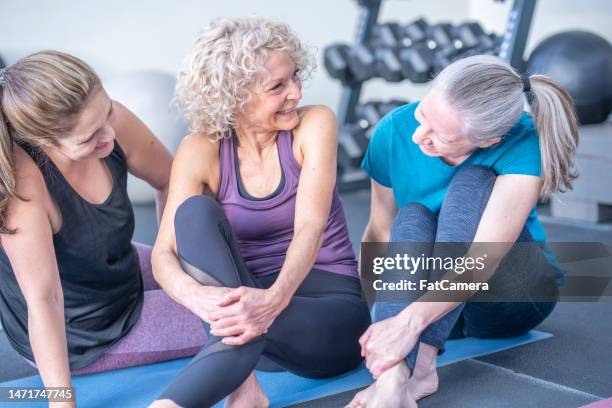 portrait of fitness women - senior yoga stock pictures, royalty-free photos & images