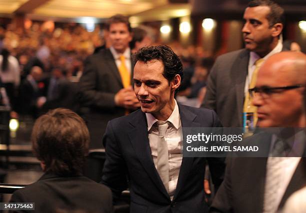 Singer Marc Anthony arrives in the audience to listen President Barack Obama at Obama Victory Fund concert in Miami, Florida, on June 26, 2012. Obama...