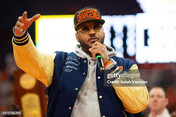 Carmelo Anthony speaks to the crowd during the 20th anniversary celebration of the 2003 national championship at JMA Wireless Dome on March 4, 2023...