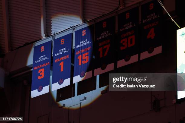 Spotlight shines on Gerry McNamara and Hakim Warricks banners as their raised during the 20th anniversary of the 2003 National Championship...