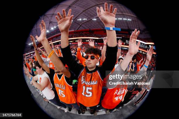 The student section for the Syracuse Orange raise their arms for a free throw during a mens basketball game between the Syracuse Orange and the Wake...