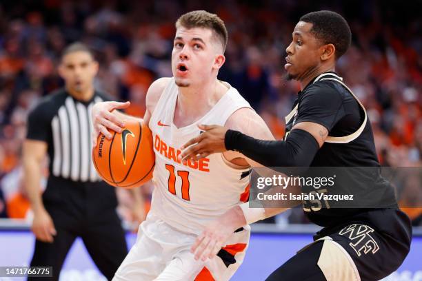 Joseph Girard III of the Syracuse Orange drives to the basket against at JMA Wireless Dome on March 4, 2023 in Syracuse, New York.