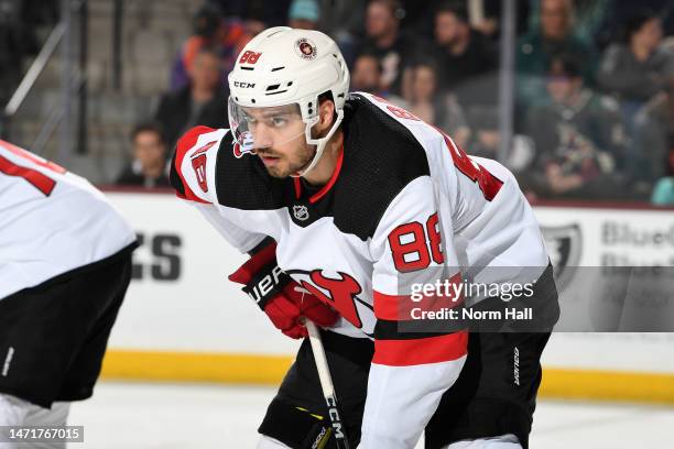 Kevin Bahl of the New Jersey Devils gets ready during a face off against the Arizona Coyotes at Mullett Arena on March 05, 2023 in Tempe, Arizona.