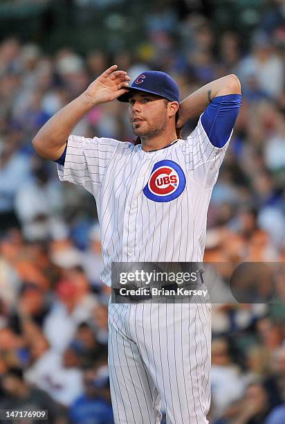 Starting pitcher Randy Wells of the Chicago Cubs adjusts his hat during the third inning against the New York Mets at Wrigley Field on June 26, 2012...