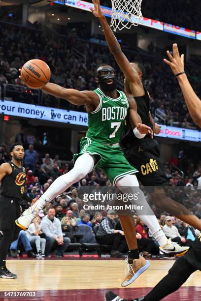 Jaylen Brown of the Boston Celtics passes around Evan Mobley of the Cleveland Cavaliers during the second quarter at Rocket Mortgage Fieldhouse on...