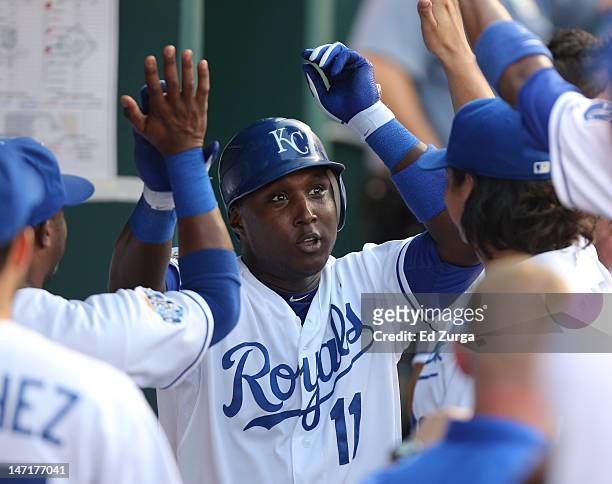 Yuniesky Betancourt of the Kansas City Royals celebrates his two-run home run with teammates during a game against the Tampa Bay Rays in the third...