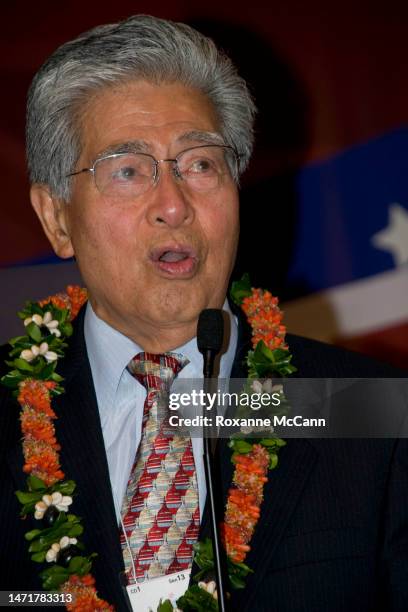 Senator Daniel Kahikina Akaka , wearing lei, closes the Democratic State Convention by leading the song Aloha Hawai'i, after giving a speech in...