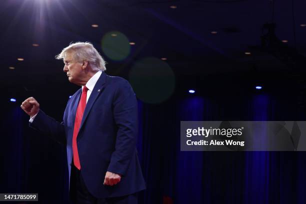 Former U.S. President Donald Trump acknowledges the crowd as he addresses the annual Conservative Political Action Conference at Gaylord National...