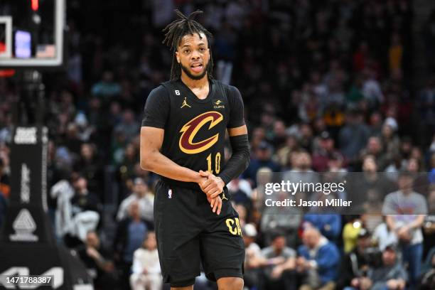 Darius Garland of the Cleveland Cavaliers grasps his hand after being fouled during the fourth quarter against the Boston Celtics at Rocket Mortgage...