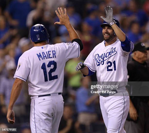 Jeff Francoeur of the Kansas City Royals celebrates his three-run home run with Mitch Maier of the Kansas City Royals during a game against the Tampa...