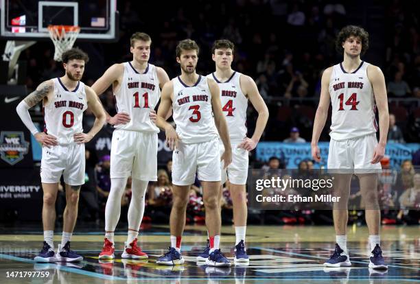 Logan Johnson, Mitchell Saxen, Augustas Marciulionis, Alex Ducas and Kyle Bowen of the Saint Mary's Gaels stand on the court in the second half of a...
