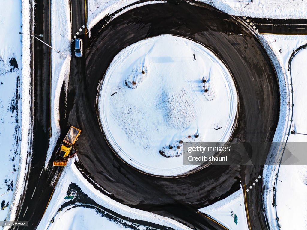 Snowplow Operator Clears Off/On Ramp Roundabout