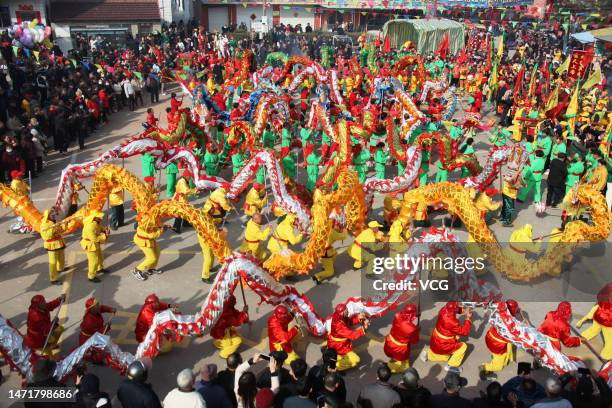 Villagers perform dragon dances during a traditional temple fair in Jiangyan District on March 6, 2023 in Taizhou, Jiangsu Province of China.