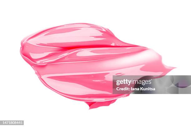 pink lipstick smear on white background, isolated. face cream smudged. beauty cosmetic pattern. makeup and skin care products. - damp lips stock-fotos und bilder