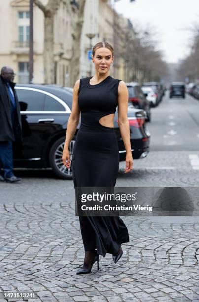 Perry wears black cut out dress outside Stella McCartney during Paris Fashion Week - Womenswear Fall Winter 2023 2024 : Day Eight on March 06, 2023...