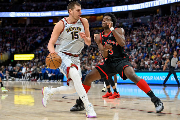 Nikola Jokic of the Denver Nuggets is defended by O.G. Anunoby of the Toronto Raptors in a game at Ball Arena on March 6, 2023 in Denver, Colorado....