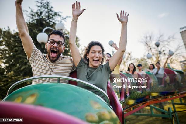 fun on rollercoaster ride! - amusement park ride stockfoto's en -beelden