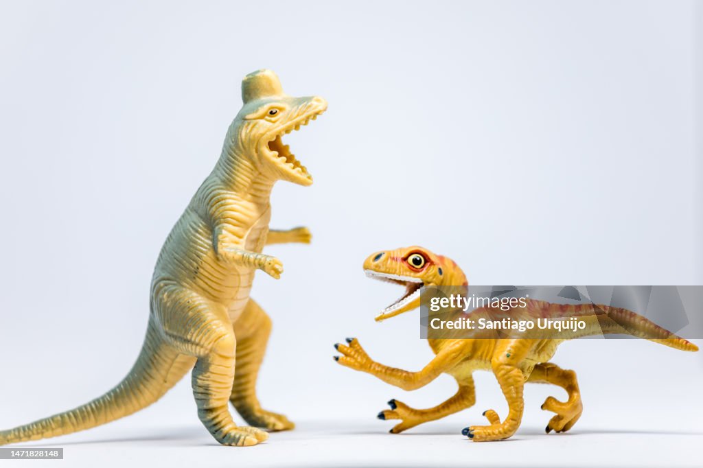 Close-up of Corythosaurus and Utahraptor fighting