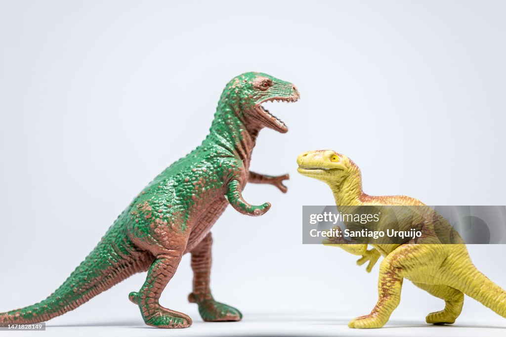 Close-up of Tyrannosaurus and Eoraptor fighting