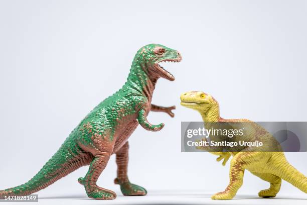 Closeup Of Tyrannosaurus And Eoraptor Fighting High-Res Stock Photo