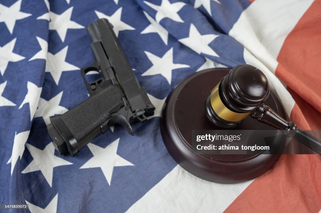 Gun and gravel on American flag.