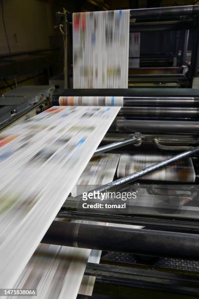 newspaper printing press in a printing plant - printed media stockfoto's en -beelden