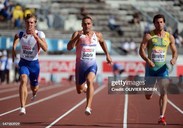 France's Kevin Mayer, Czech Republic's Roman Sebrle and Sweden's Bjorn Barrefors compete during the men's decathlon 100m heat 2 of the 2012 European...