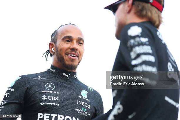 Lewis Hamilton of Great Britain and Mercedes speaks with Valtteri Bottas of Finnland and Alfa Romeo F1 during the drivers parade ahead the F1 Grand...